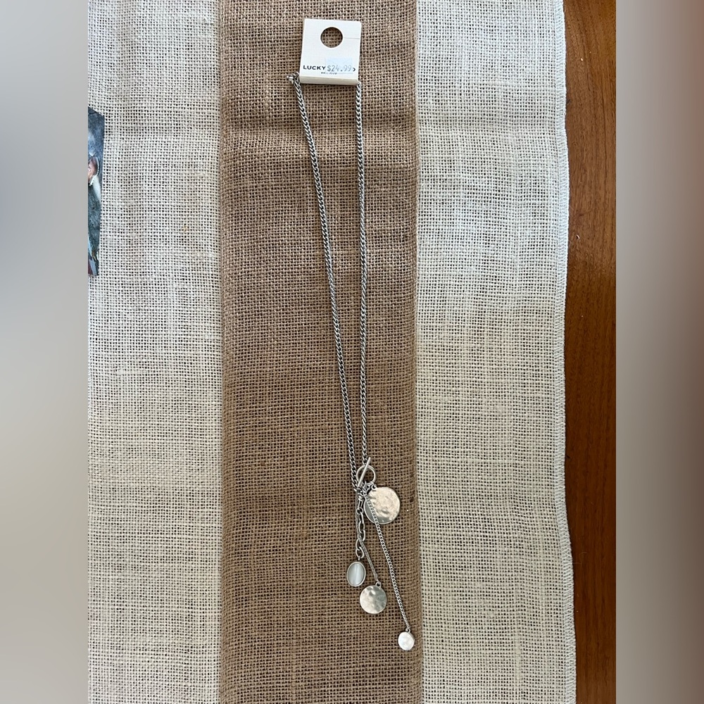 Medallion necklace.